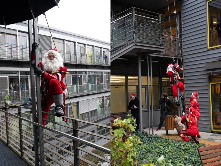 Ein Kletterer der Höhenrettung der Dresdner Feuerwehr bringt Geschenke für...